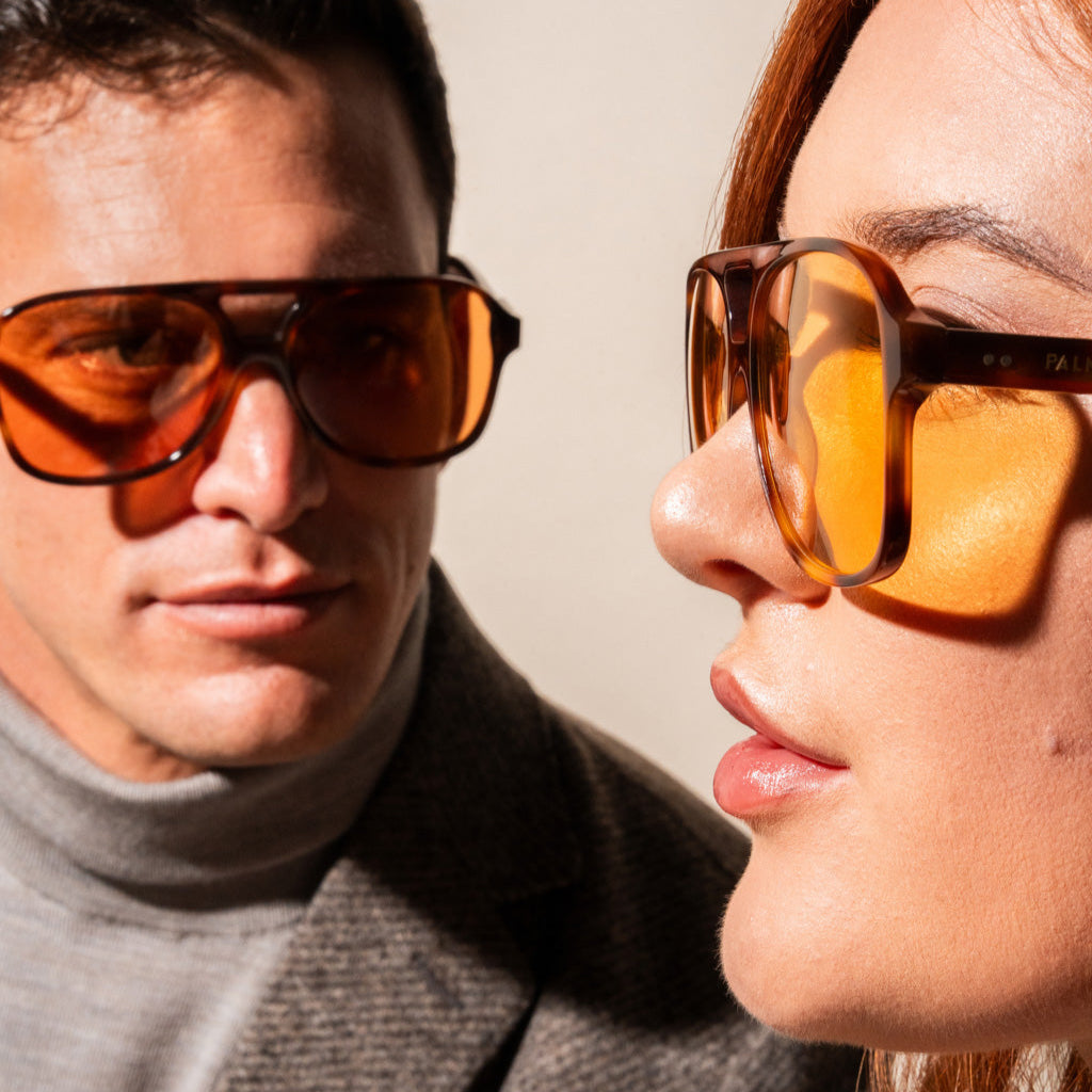 orange sunglasses with tortoise frame on a couple