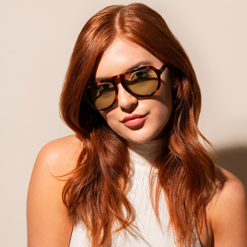 Olive sunglasses with tortoise frame on woman