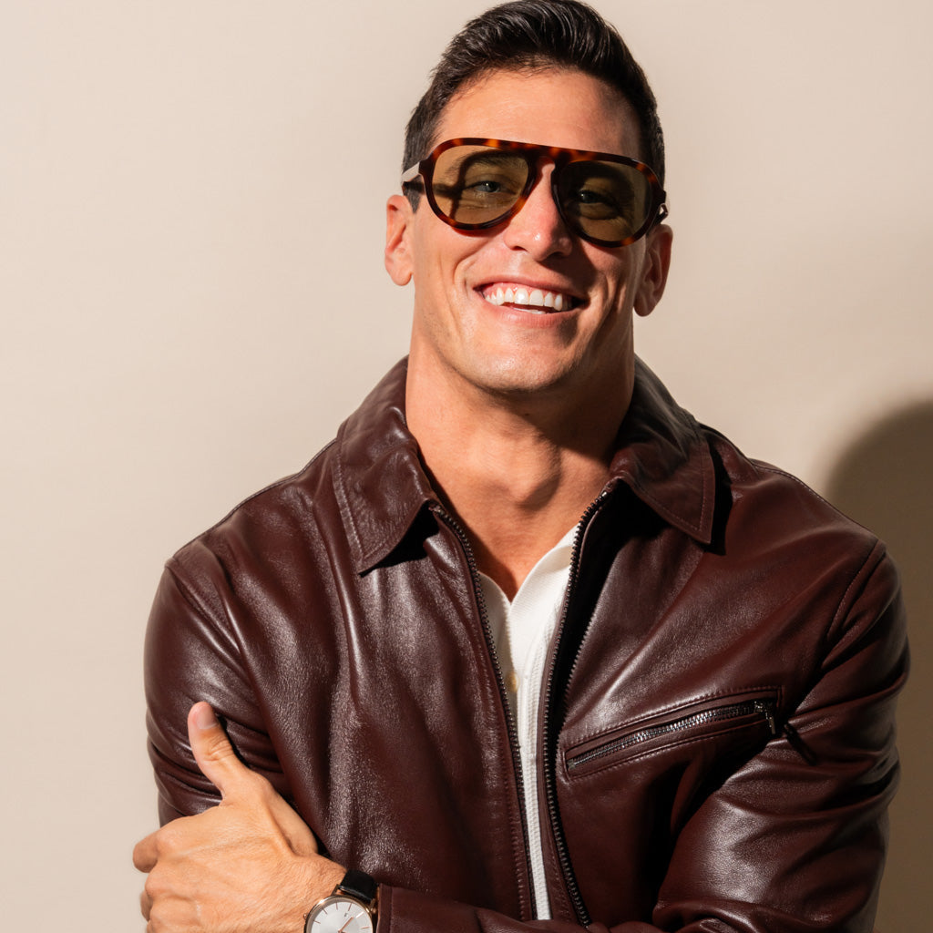Olive sunglasses with tortoise frame on a man