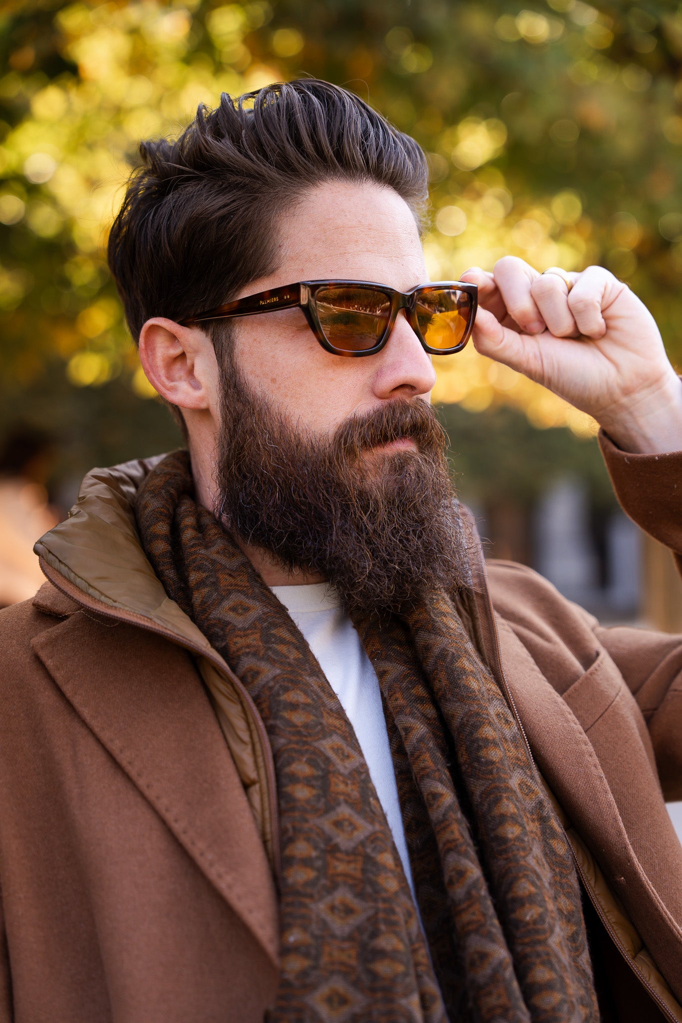 Man wearing Palmiers Eyewear The Artist sunglasses in brûlée colorway outdoors.
