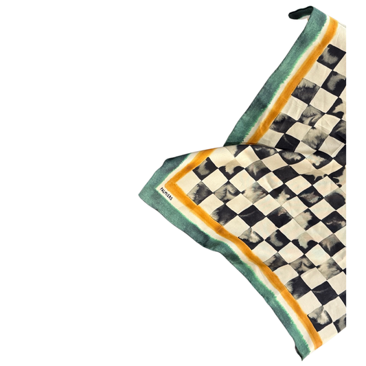 Checkered silk scarf with green border on a white background