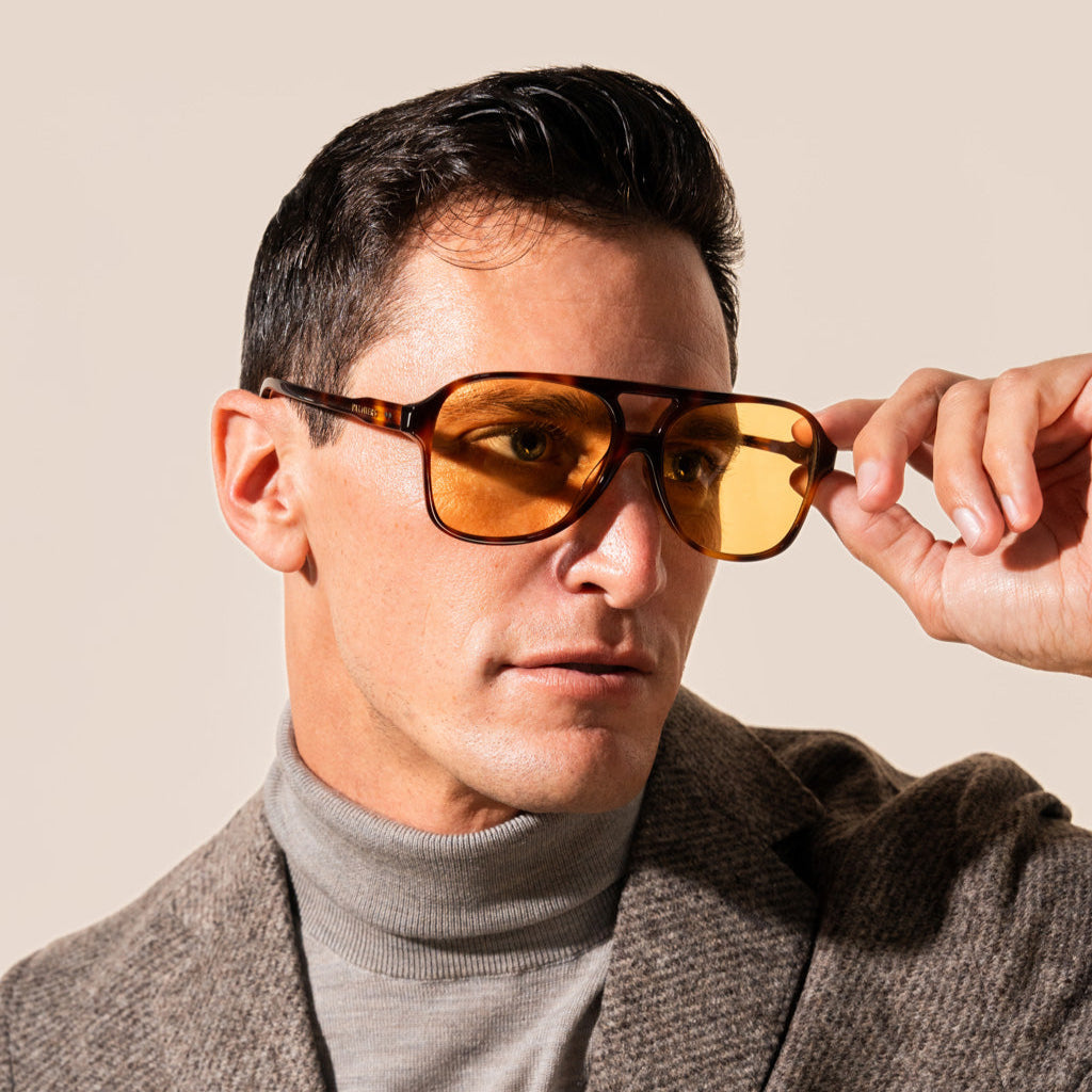 yellow sunglasses with tortoise frame on man