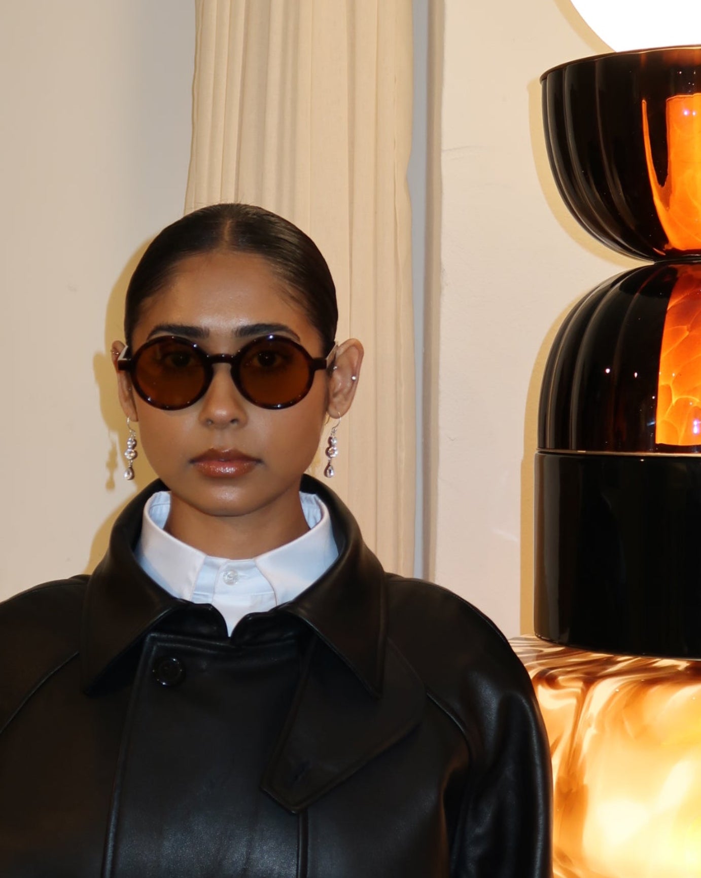 Woman wearing Palmiers Eyewear The Collector sunglasses in brulee colorway.
